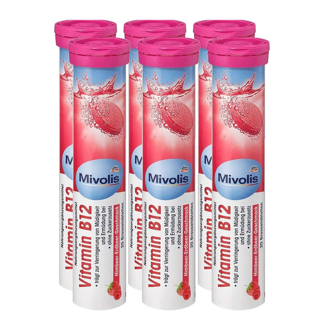 Multiple Mivolis Vitamin B12 tablets with pink lids on a white background
