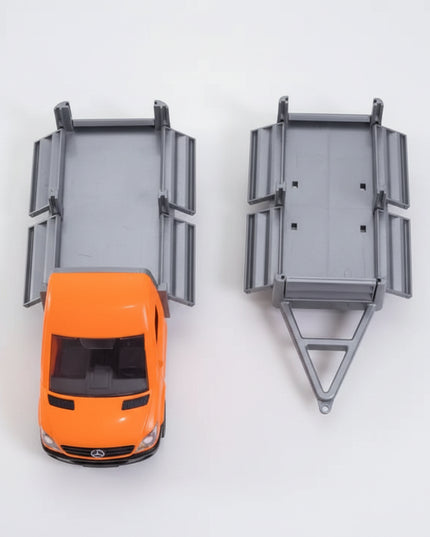 A detailed miniature&nbsp;Mercedes-Benz Sprinter flatbed truck with trailer, crafted for imaginative play and collectors.
The bright orange construction-style design and smooth-rolling wheels make it perfect for hauling, loading, and transport-themed play.