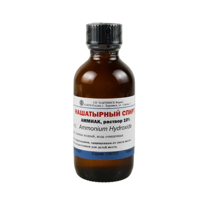 Ammonium hydroxide bottle with label on a white background