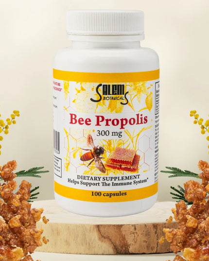Bottle of Salem Botanical Bee Propolis supplement with honeycomb and bee illustration on a beige background.