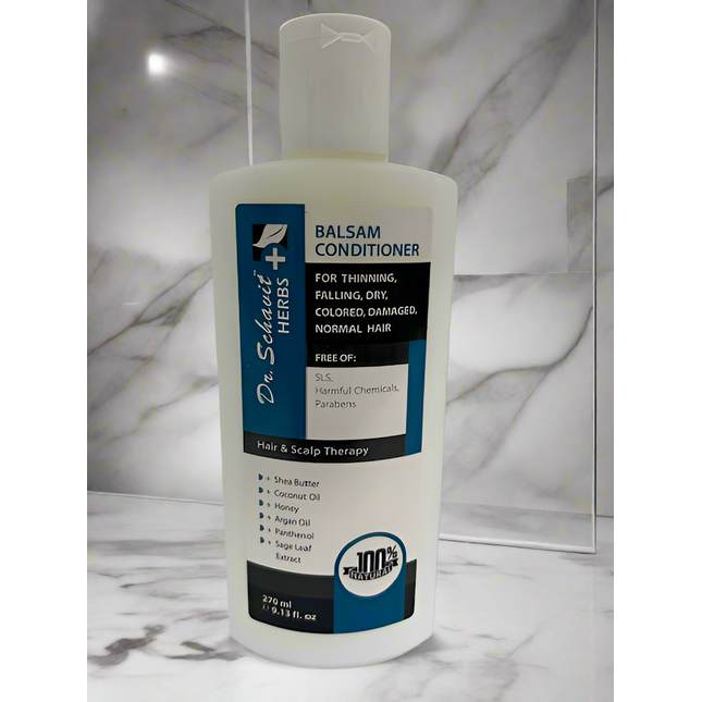 Bottle of Dr. Schuster+ Herbs Balsam Conditioner on a marble surface