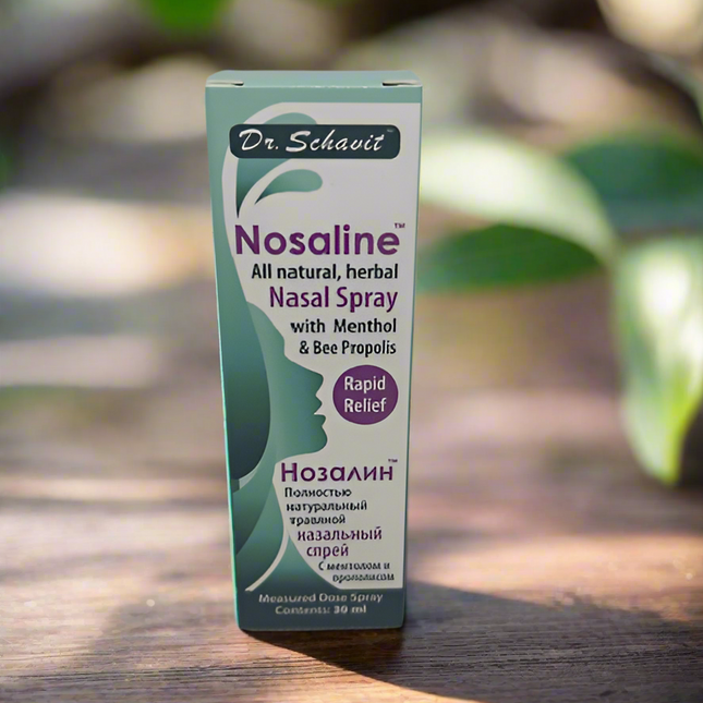 Dr. Schavit Nosaline nasal spray box on a wooden surface with greenery in the background