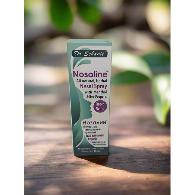 Dr. Schavit Nosaline nasal spray box on a wooden surface with greenery in the background