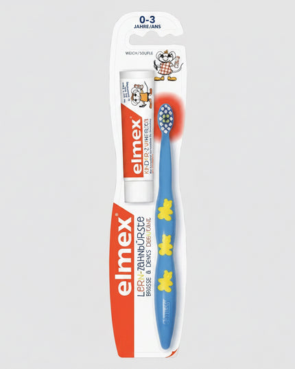 Elmex Lollipopchild toothbrush in blue with yellow flower accents, in its original retail blister packaging with a white and orange backing card.