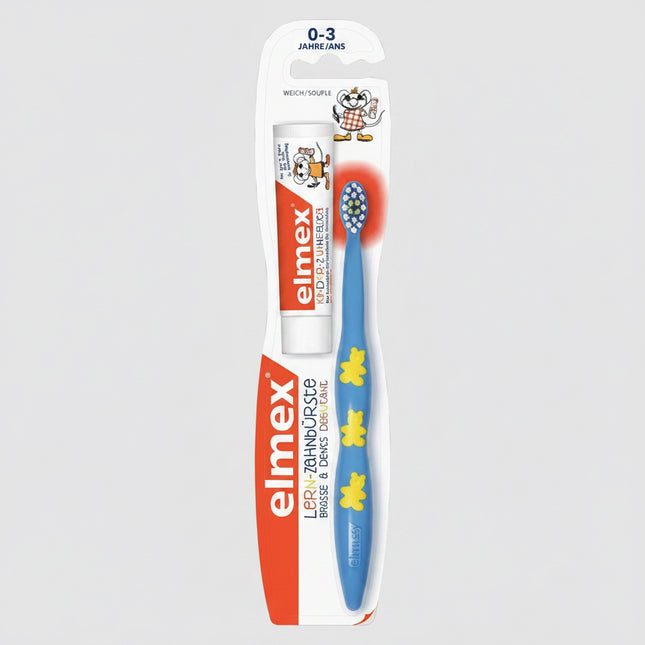 Elmex Lollipopchild toothbrush in blue with yellow flower accents, in its original retail blister packaging with a white and orange backing card.