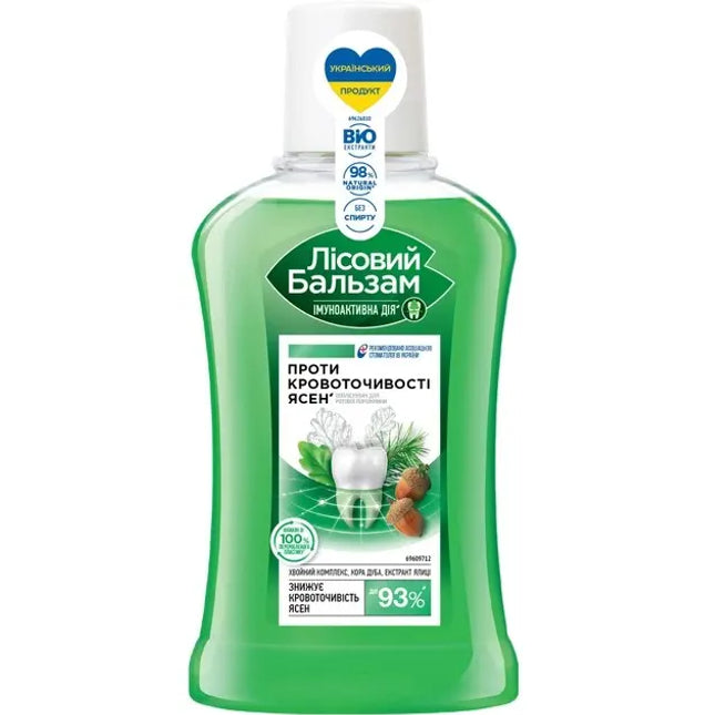 Bottle of 'Lisovyy Balzam' mouthwash with green label on a white background