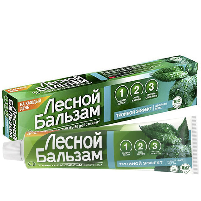 Green toothpaste packaging with text on a white background