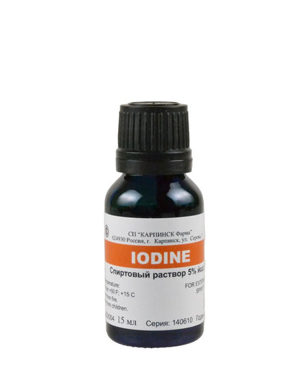 Bottle of iodine solution with a label on a white background