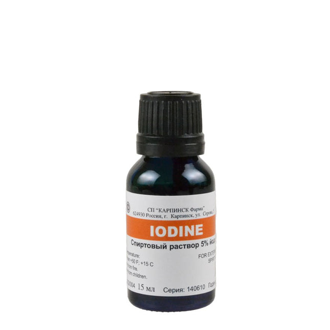 Bottle of iodine solution with a label on a white background