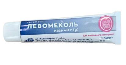 Tube of Levomekol ointment with blue label on a white background