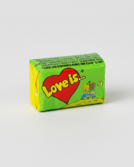 Love Is… Chewing Bubble Gum is the iconic Turkish bubble gum remembered for its colorful wrappers, fruity flavor combinations, and charming “Love Is…” collectible comic inserts.