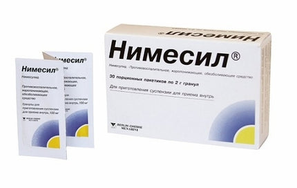Box and packets of Nimecil medication on a white background