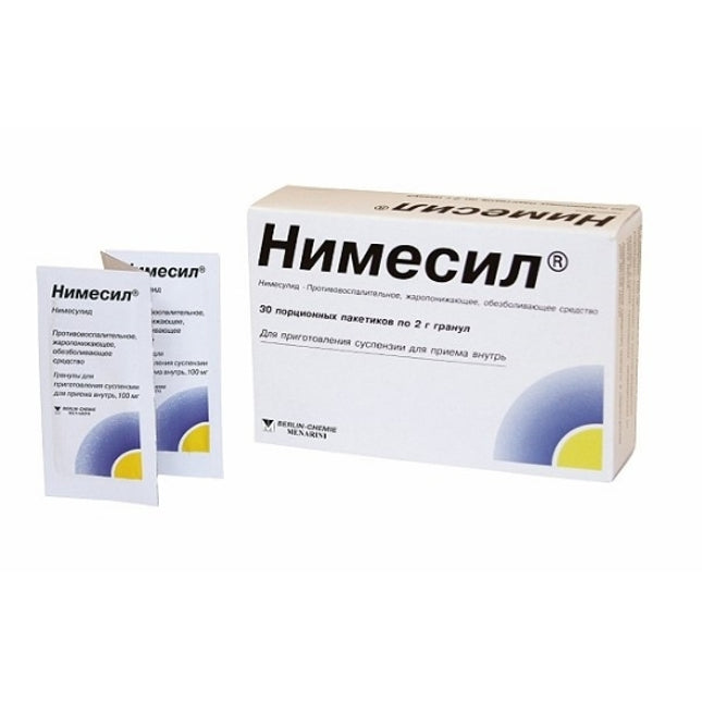 Box and packets of Nimecil medication on a white background