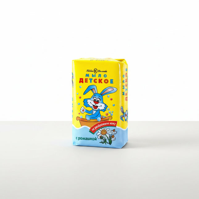 Nevskaya Kosmetika Baby Soap (Детское мыло) is a classic gentle cleansing bar specially formulated for delicate children's skin. It is also suitable for adults with sensitive skin.

The soap is made from a traditional base of natural fats and oils and contains glycerin and mink oil, which help soften the skin and protect it from excessive dryness during washing. The classic formula contains no added fragrance or colorants.

Its mild cleansing action and creamy lather make it suitable for regular hand and bo