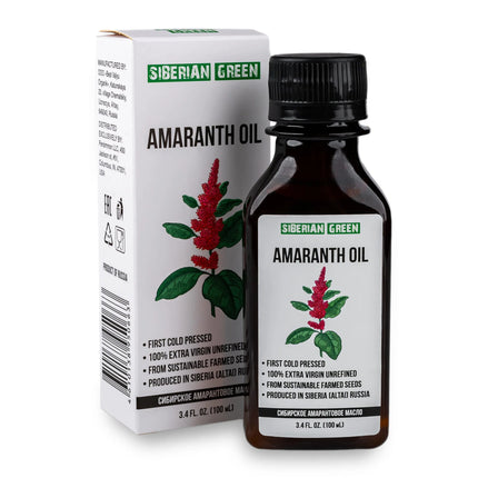A bottle of Siberian Green Amaranth Oil next to its packaging box. The bottle has a label with an image of the amaranth plant, and the box has product information and branding.