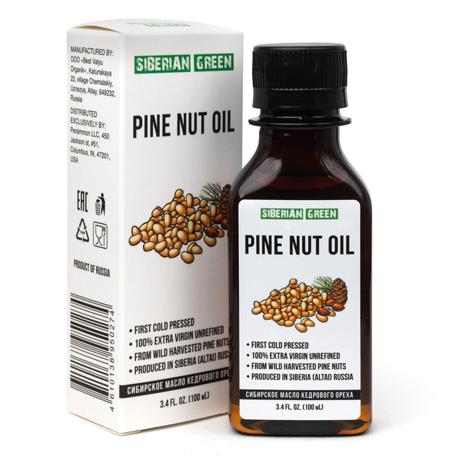 Bottle and box of Siberian Green Pine Nut Oil on a white background