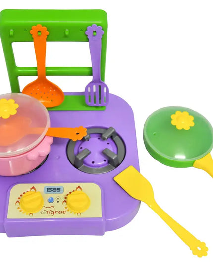 Colorful toy kitchen set with stove, pots, and utensils on a white background