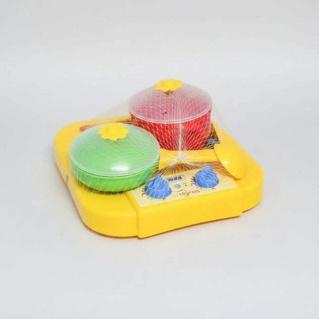 The dinner set "Chamomile" with kitchen is made from safe food plastic. It is suitable for use in the microwave oven as well as the dishwasher. &nbsp;&nbsp;
The dinner set "Chamomile" with kitchen includes a gas stove with two hot plates and a stand for kitchen utensils, one pan and a frying pan, a soup ladle, a slotted spoon, and two spatulas. &nbsp;In front of each burner, there is a switch, when you turn it on you hear a click. &nbsp;The handle of the pan is removed.&nbsp;