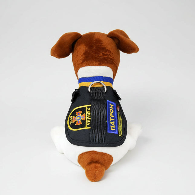 The toy is a stylized version of Patron, a Jack Russell Terrier who became well known in Ukraine for bomb-sniffing / demining work.