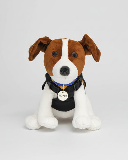 The toy is a stylized version of Patron, a Jack Russell Terrier who became well known in Ukraine for bomb-sniffing / demining work.