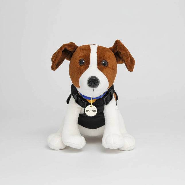 The toy is a stylized version of Patron, a Jack Russell Terrier who became well known in Ukraine for bomb-sniffing / demining work.