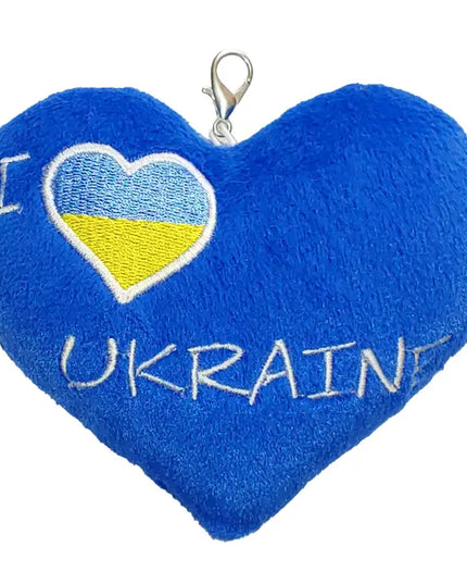 Blue heart-shaped plush keychain with 'I ❤️ Ukraine' text on a white background