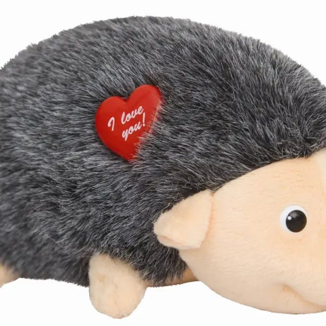 Plush hedgehog toy with a red heart that says 'I love you' on a white background