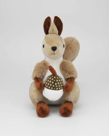Plush toy squirrel holding a pine cone 