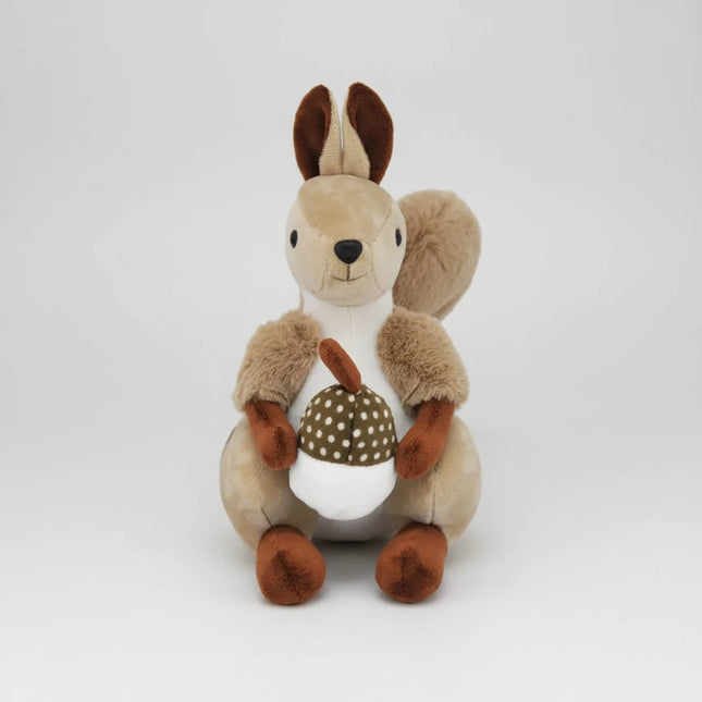 Plush toy squirrel holding a pine cone 