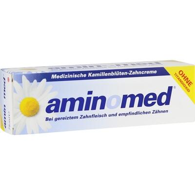 Aminomed dental cream packaging with a daisy on a white background