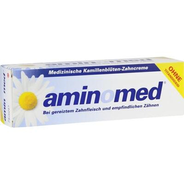Aminomed dental cream packaging with a daisy on a white background