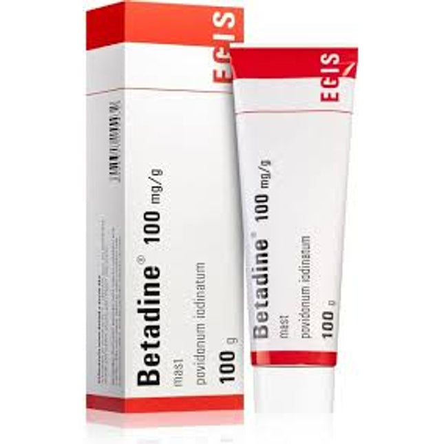Betadine 100 mg/g antiseptic solution tube and box on a white background