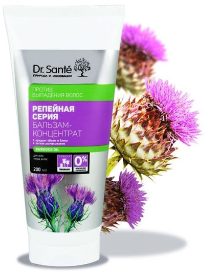 Dr. Sante hair care product with thistle flowers on a white background