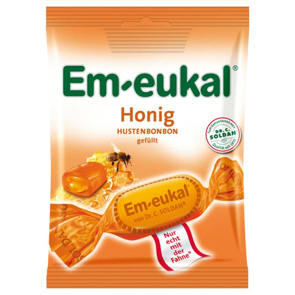 Em-eukal honey lozenge package with a bee and honeycomb illustration on an orange background