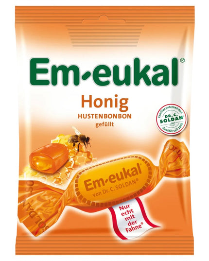 Em-eukal honey lozenge package with a bee and honeycomb illustration on an orange background