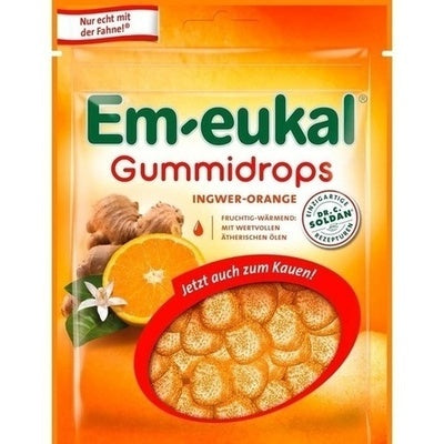 Em-eukal ginger-orange gummy drops packaging with ginger and orange elements.