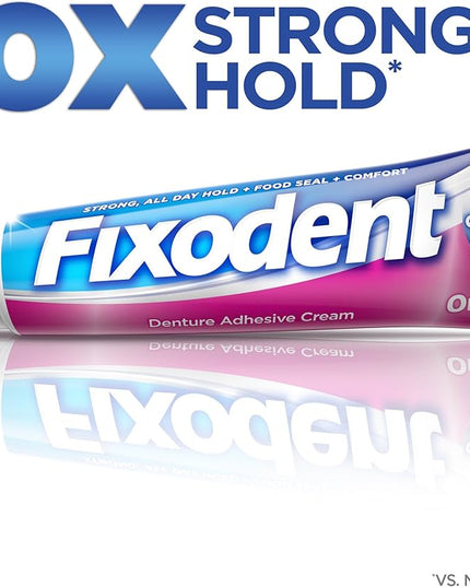 Fixodent denture adhesive cream tube with '10X Stronger Hold' text on a white background