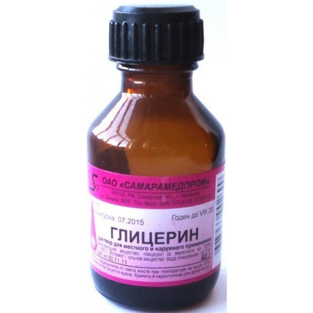 Amber glass bottle with a black cap and pink label on a white background