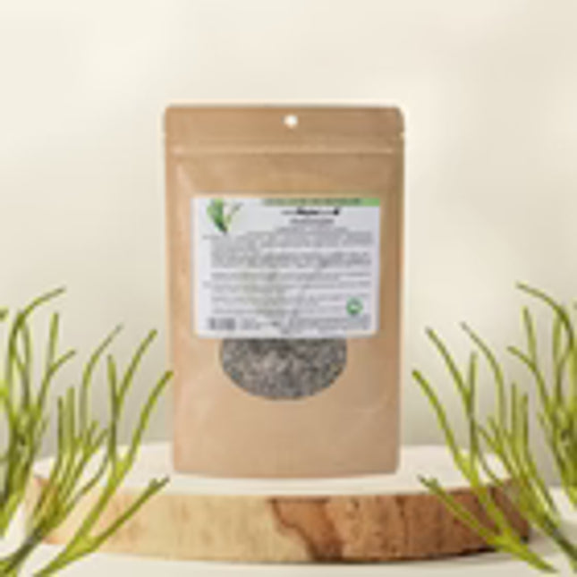 Sealed package of dried herbs on a wooden surface with a white background