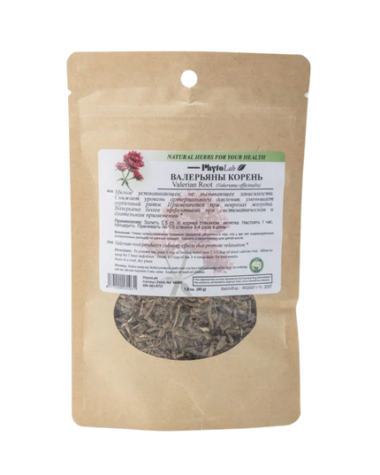 Brown paper bag with dried herbs and a label on a white background