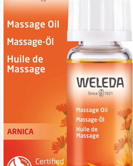 Weleda Arnica massage oil bottle and packaging on a white background