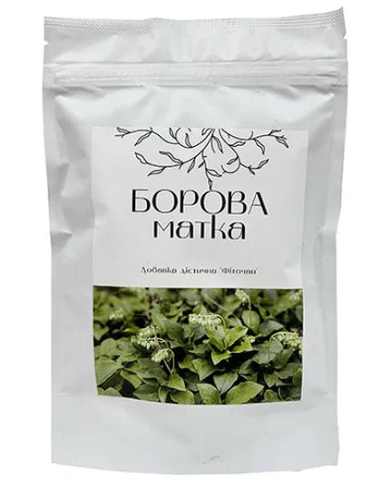 White packaging with green leaf image and text on a white background